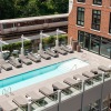Roof Top deck with a sparkling blue pool 