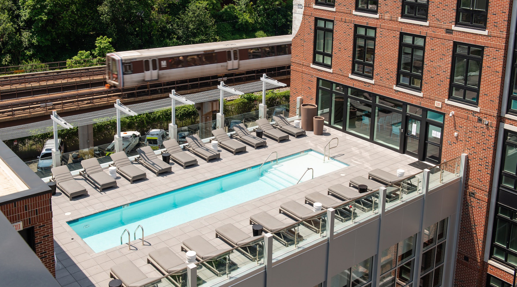 Swimming Pool Roof Top deck with a sparkling blue pool