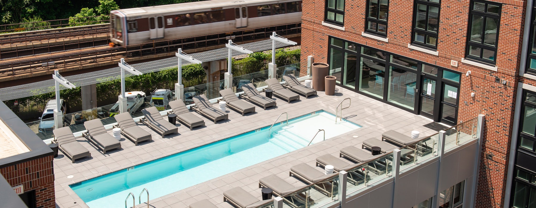 Roof Top deck with a sparkling blue pool 